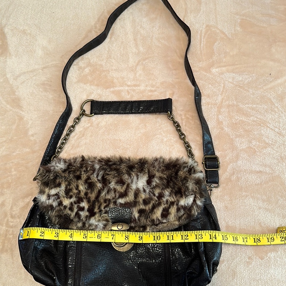 Bueno bag with fur. Comes with 2 straps.  Used one time.